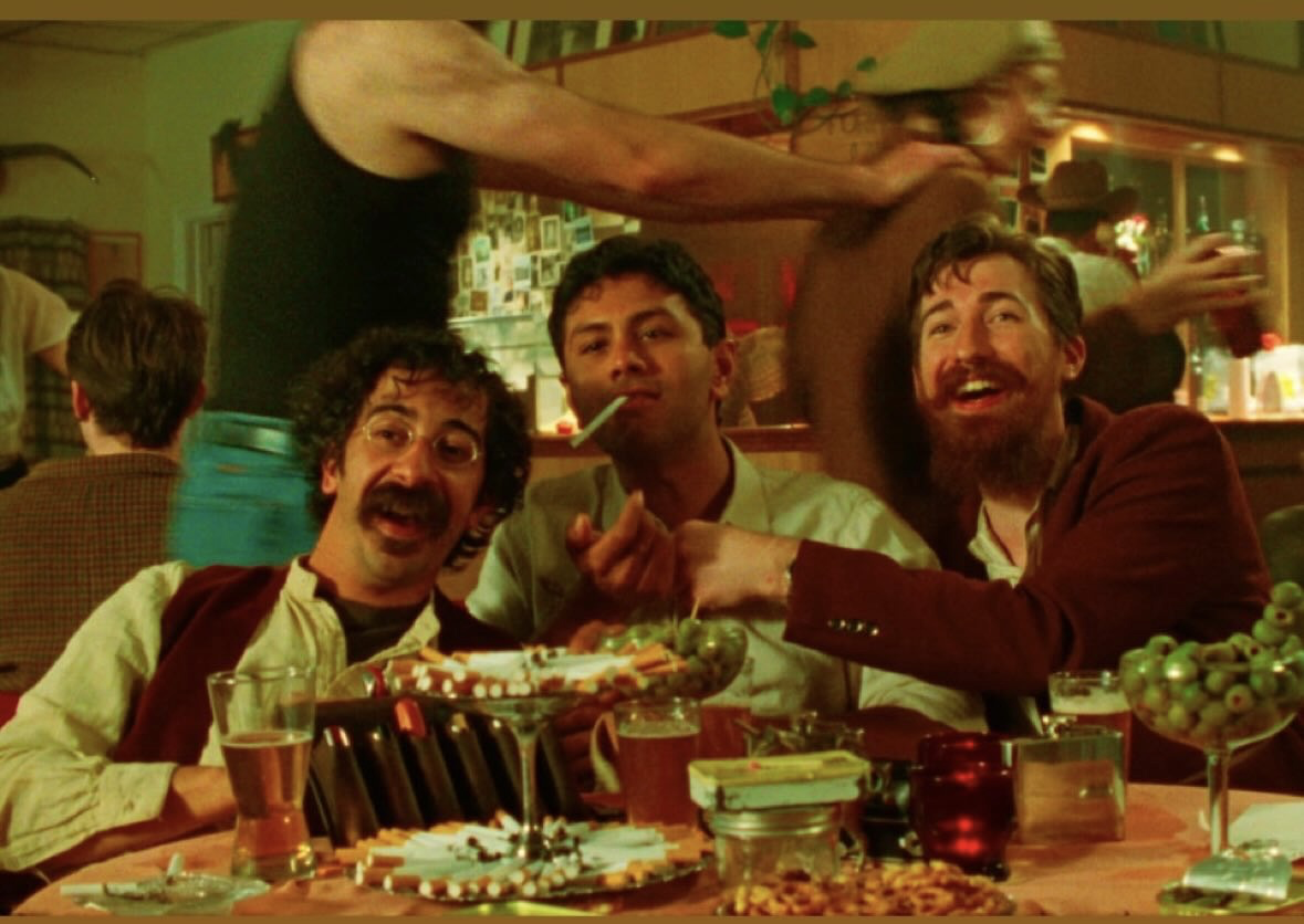 Sal with friends gathered around a table